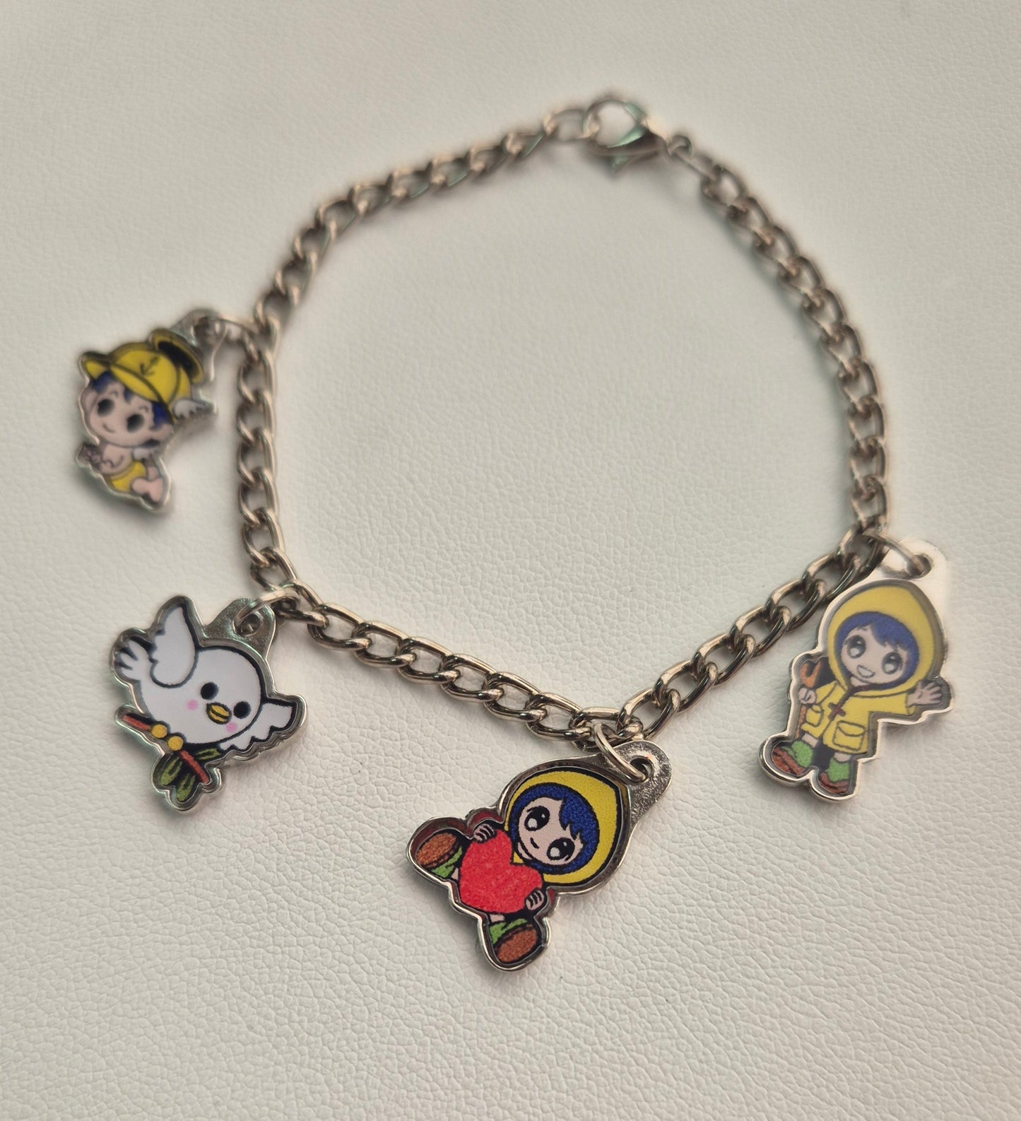 Pulsera plateada X 4 charms